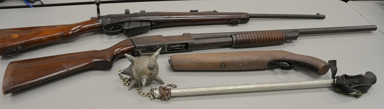 Weapons, cash seized at Kirby Ave. home